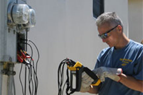 Theo Howe performing electrical troubleshooting